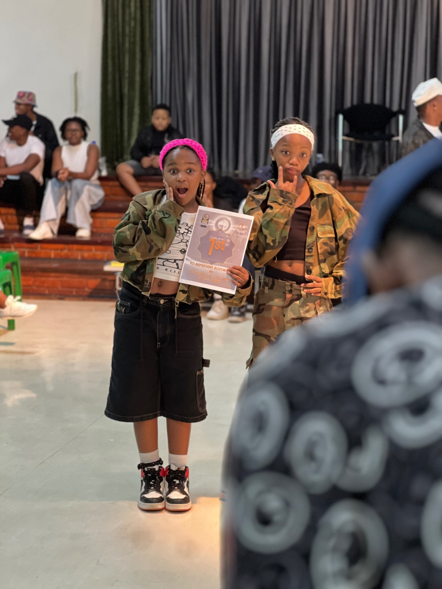 Students celebrating a first-place certificate to represent Botswana