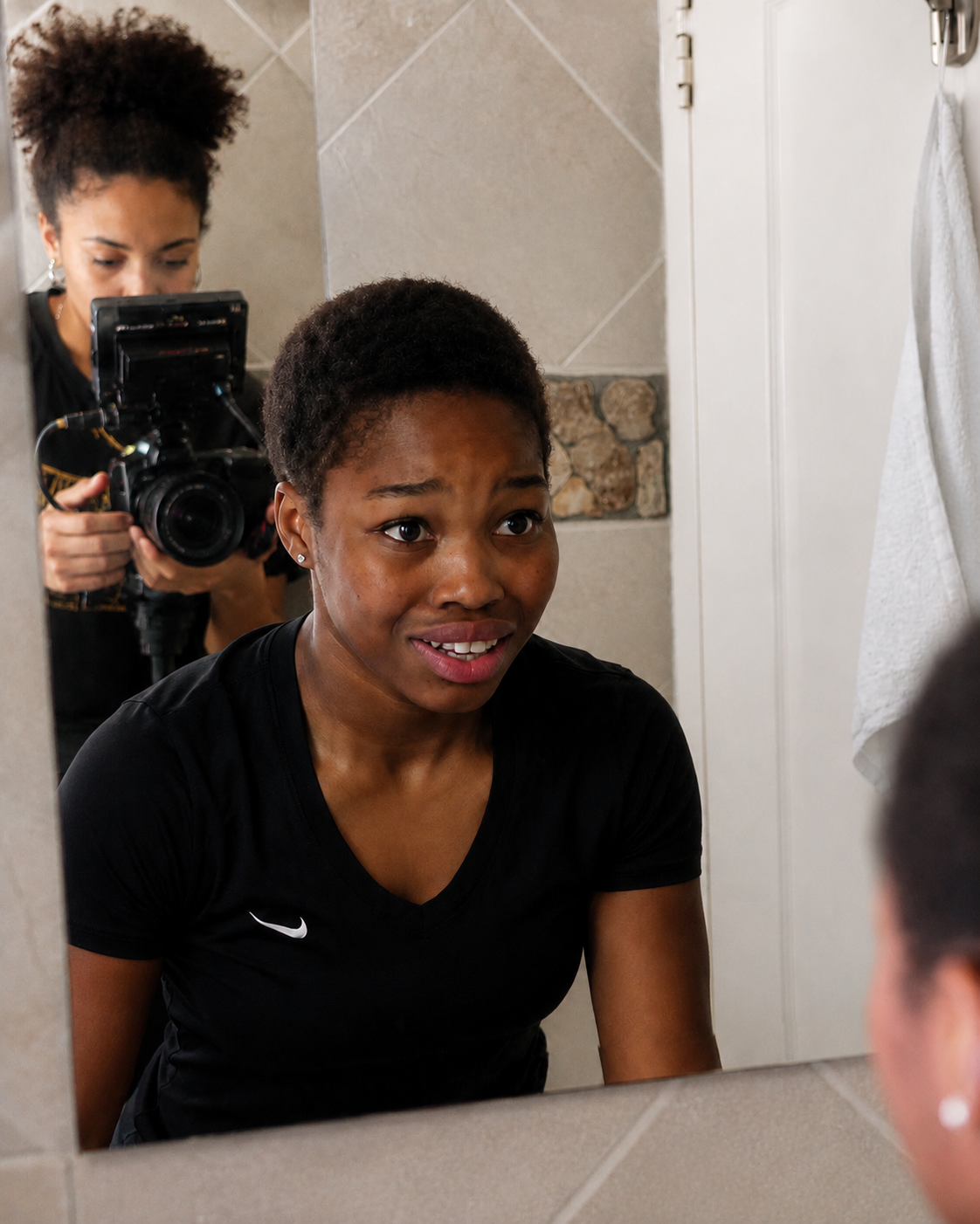 A young performer rehearsing an acting scene while being filmed