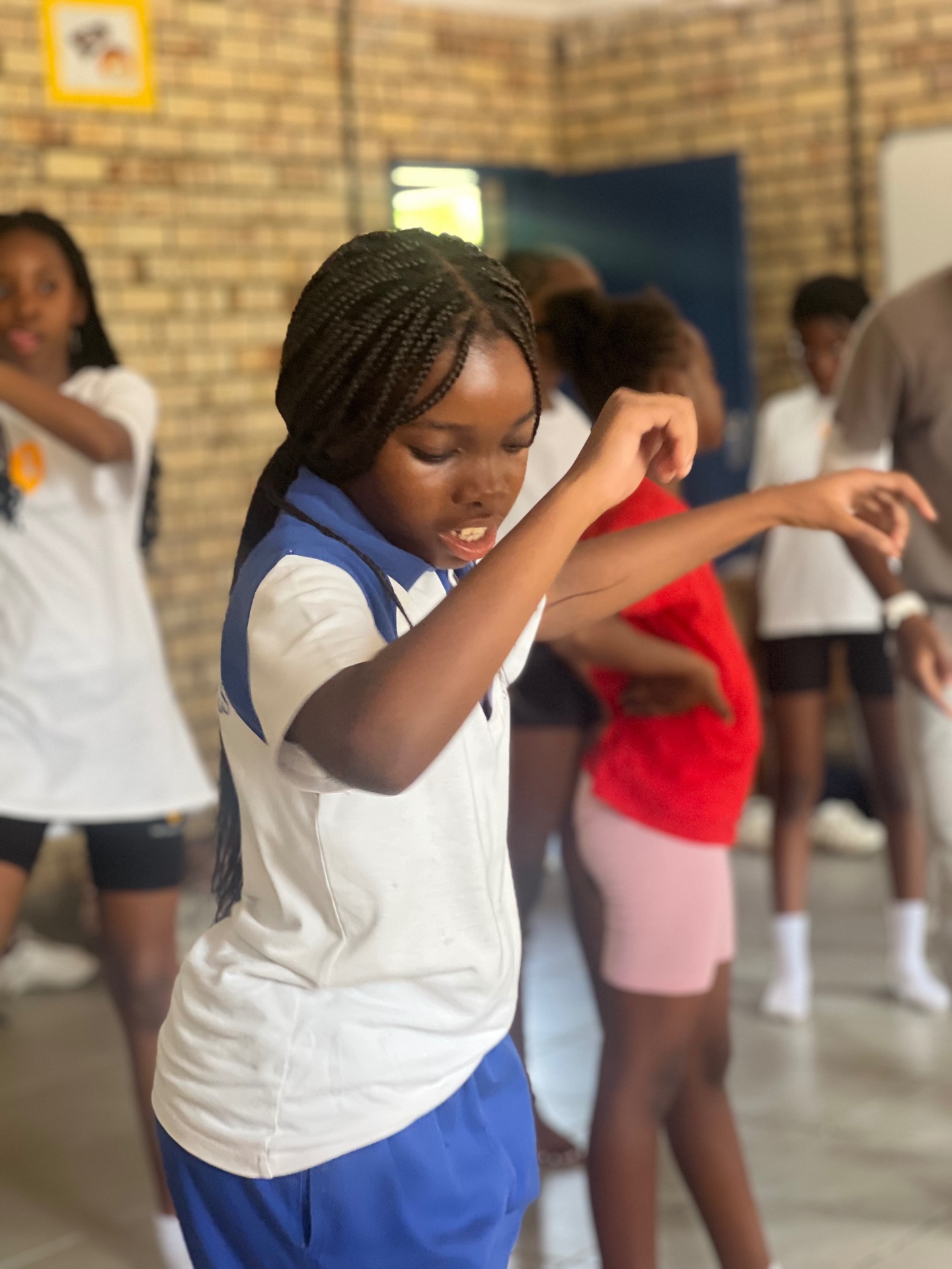 A student dancing during a school programme session